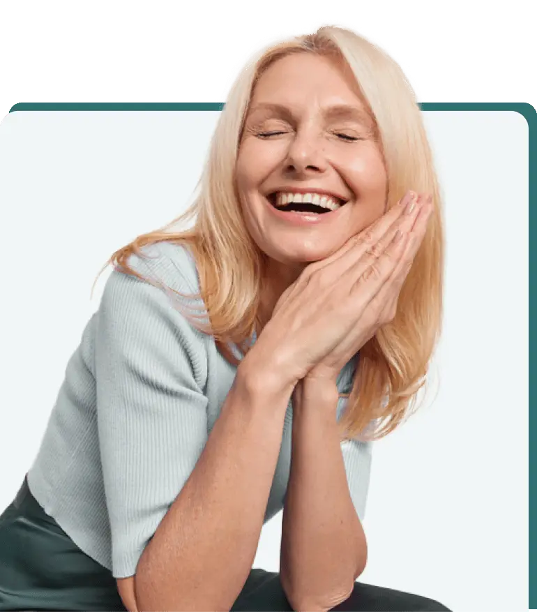 Smiling woman resting her head on her hands